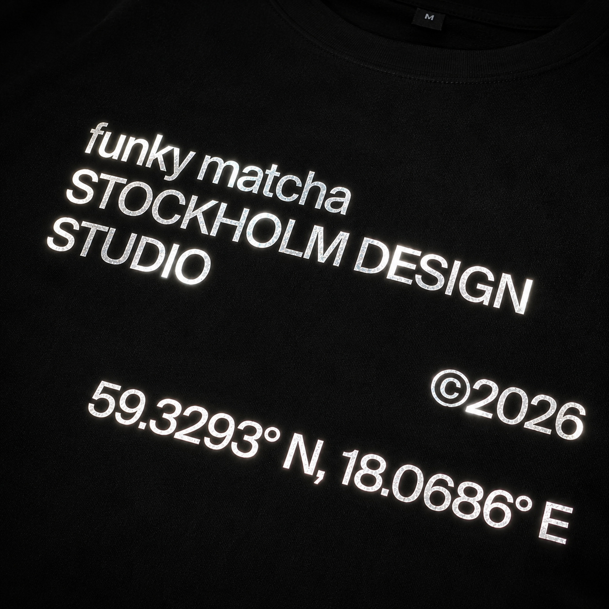 Funky Matcha Stockholm Design Studio T-Shirt — Black Boxy Fit, Silver Reflective Print (Unisex)